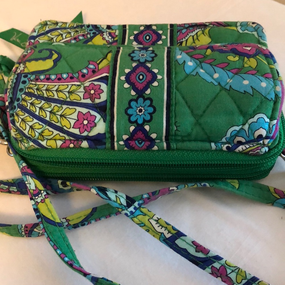 Vera Bradley cross body wallet with multiple compartments. OS